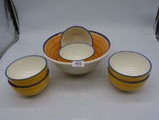 A Whittard's yellow and blue stripe salad bowl with six side bowls,