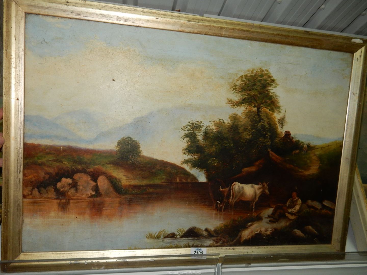 A framed Oil on canvas of cattle drinking from a river as a young cattle herder sits beneath the - Image 2 of 4