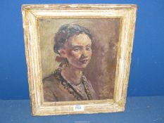 A framed Oil on board portrait of a young woman (possibly Hispanic),