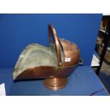 A large copper coal scuttle, 21'' long x 15 1/2'' high.