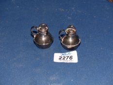A pair of Silver salt & pepper Pots in the form of old style tea caddies, Birmingham 1921 or 1946,