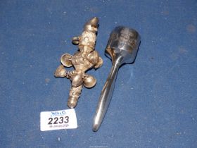 A sterling silver babies Rattle with nursery rhyme (Jack & Jill) embossed and a continental silver