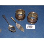 A pair of Silver napkin rings, Birmingham 1926, silver teaspoon and silver miniature cake slice,