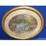 An oval framed and mounted Watercolour of a floral and fauna landscape, no visible signature,