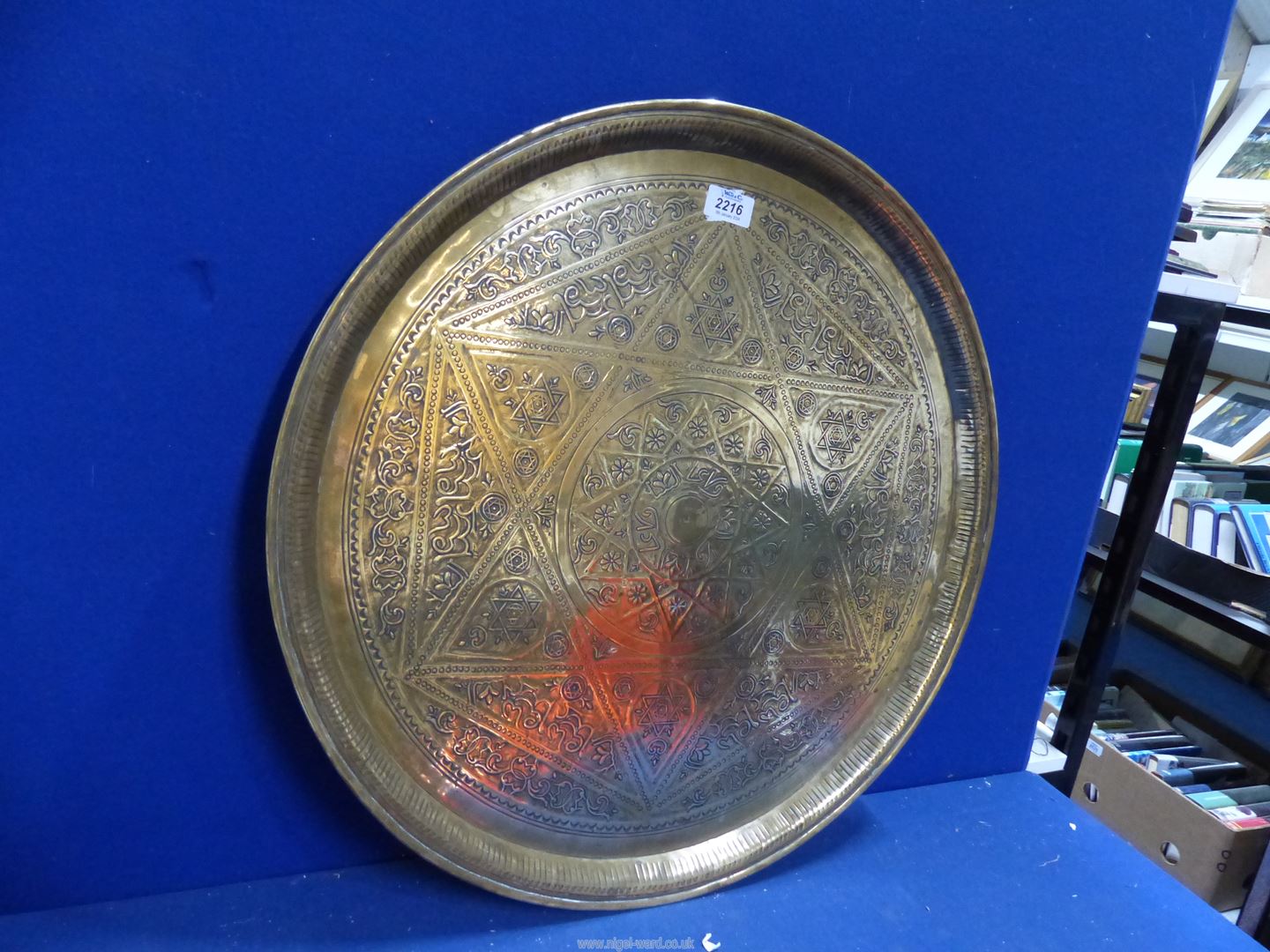 A large brass hand beaten Benares tray with Arabic script and designs, of some age, 23" diameter. - Image 2 of 2