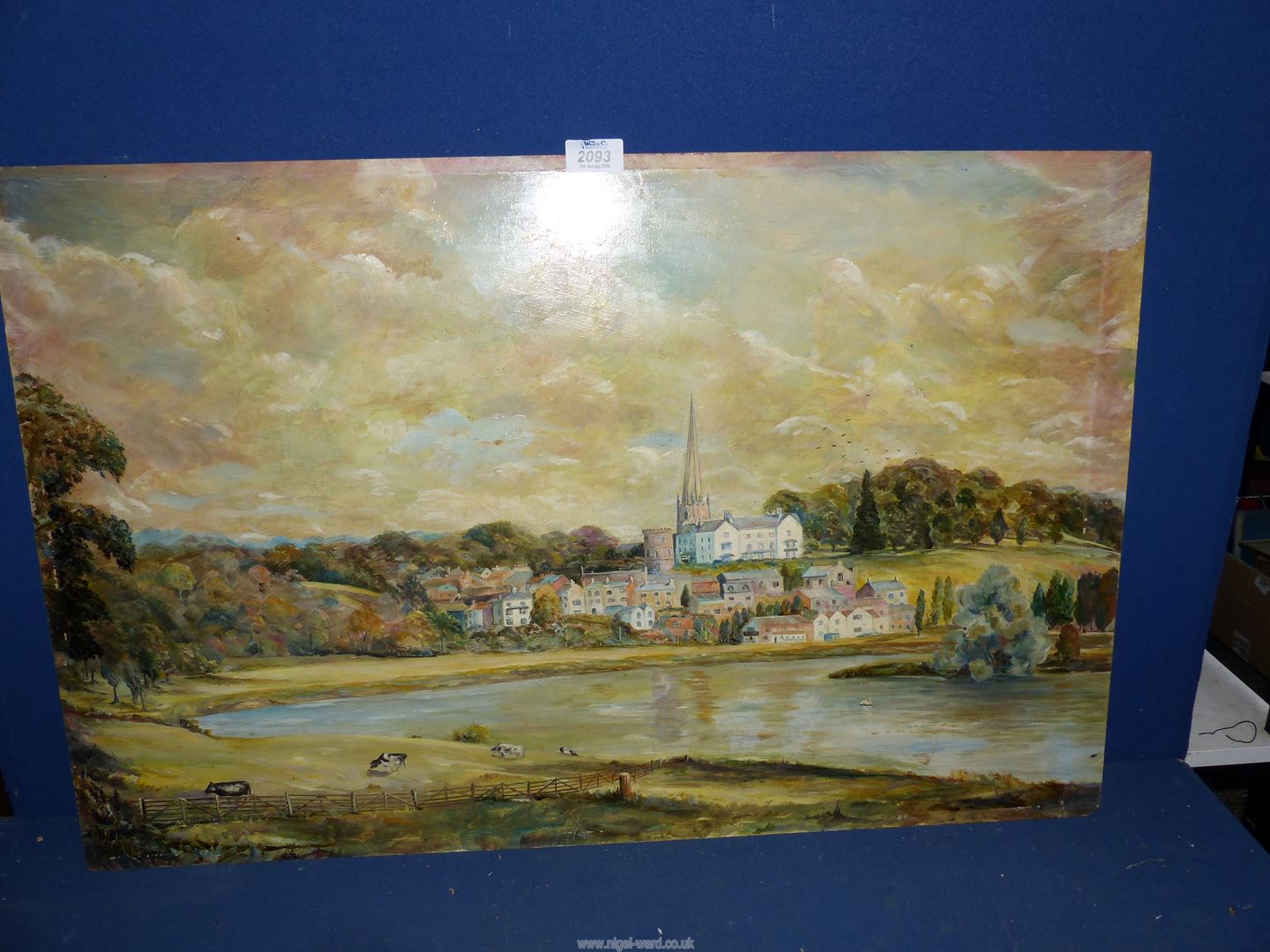 An unframed Oil on board of Ross-on-Wye with cattle grazing in the foreground, no signature,