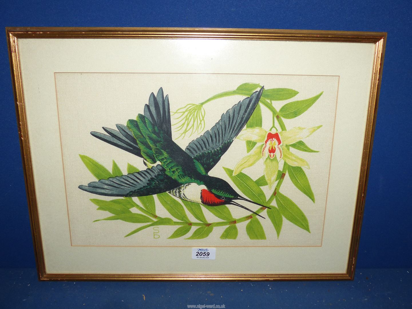 A painting on fabric of a Hummingbird signed S.B.