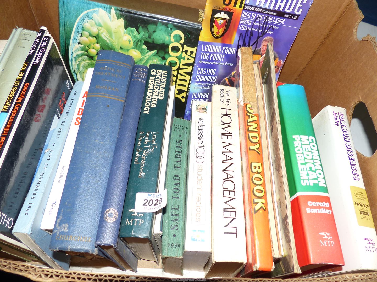 A box of books to include, Mrs Beeton's Family Cookery, Common Medical Problems,