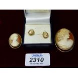 A pair of 9ct gold mounted and backed Cameo studs and two continental silver (800) mounted cameos