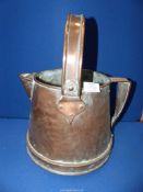 A Copper Vessel with swing handle.