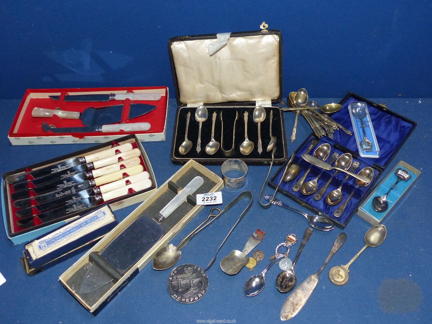 A quantity of Epns cutlery including cake slice, boxed butter knives, teaspoons, sugar tongs, etc.