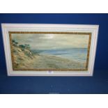 A framed Oil on board of a seascape with trees and rocky cliff to the foreground and hills in the