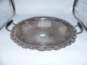 A large tray with grapevine decoration and Bakelite handles.
