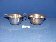 A Silver Cream jug and matching sugar bowl having flute edge, Birmingham 1944, makers Arnold E.