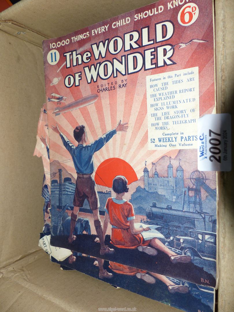 A quantity of The Wonder of The World magazines.
