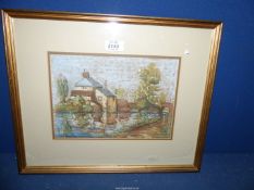 A framed and mounted Oil/Pastel of a house and river, signed lower right E.T. Jonathan, 17" x 14".