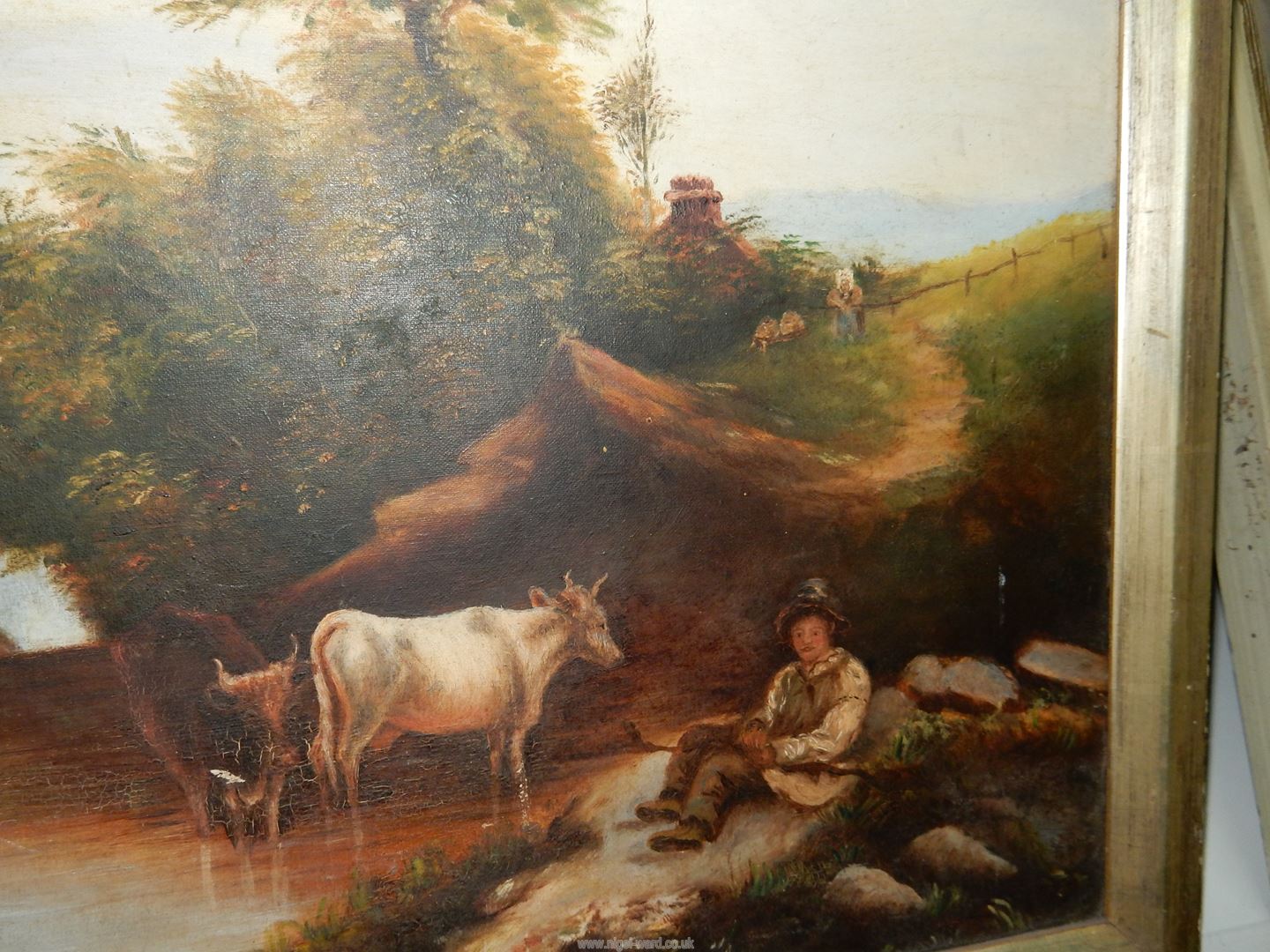 A framed Oil on canvas of cattle drinking from a river as a young cattle herder sits beneath the - Image 3 of 4