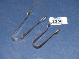 Two Silver sugar Tongs including Chester 1897 and Sheffield 1932, 25.5 grams.