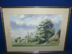 A framed and mounted but unglazed Watercolour of a cottage on a green with truncated tower,