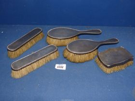 Two silver backed hairbrushes with two matching clothes brushes, date letter 'O' possibly 1913,