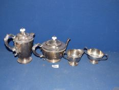 A Teaset having Celtic design to rim including teapot, hot water pot, sugar and creamer.