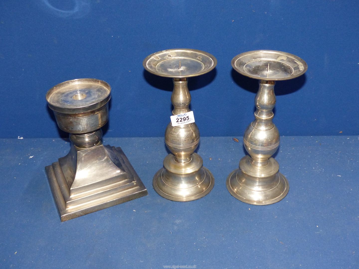 A large pair of plated pricket stands and a large plated stand.