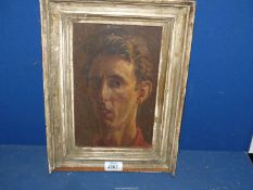 A framed (a/f) Oil on panel of a self portrait of a young gentleman, initialled lower right T.M (T.