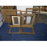 A quantity of picture frames of various styles and sizes.