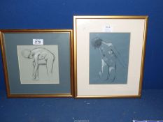 A pair of framed charcoal drawings of nudes, written verso William Monk.