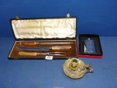 A cased carving set with antler handles, brass candlestick and boxed pewter hip flask.
