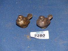 A pair of tiny salt cellars in the form of wrens.