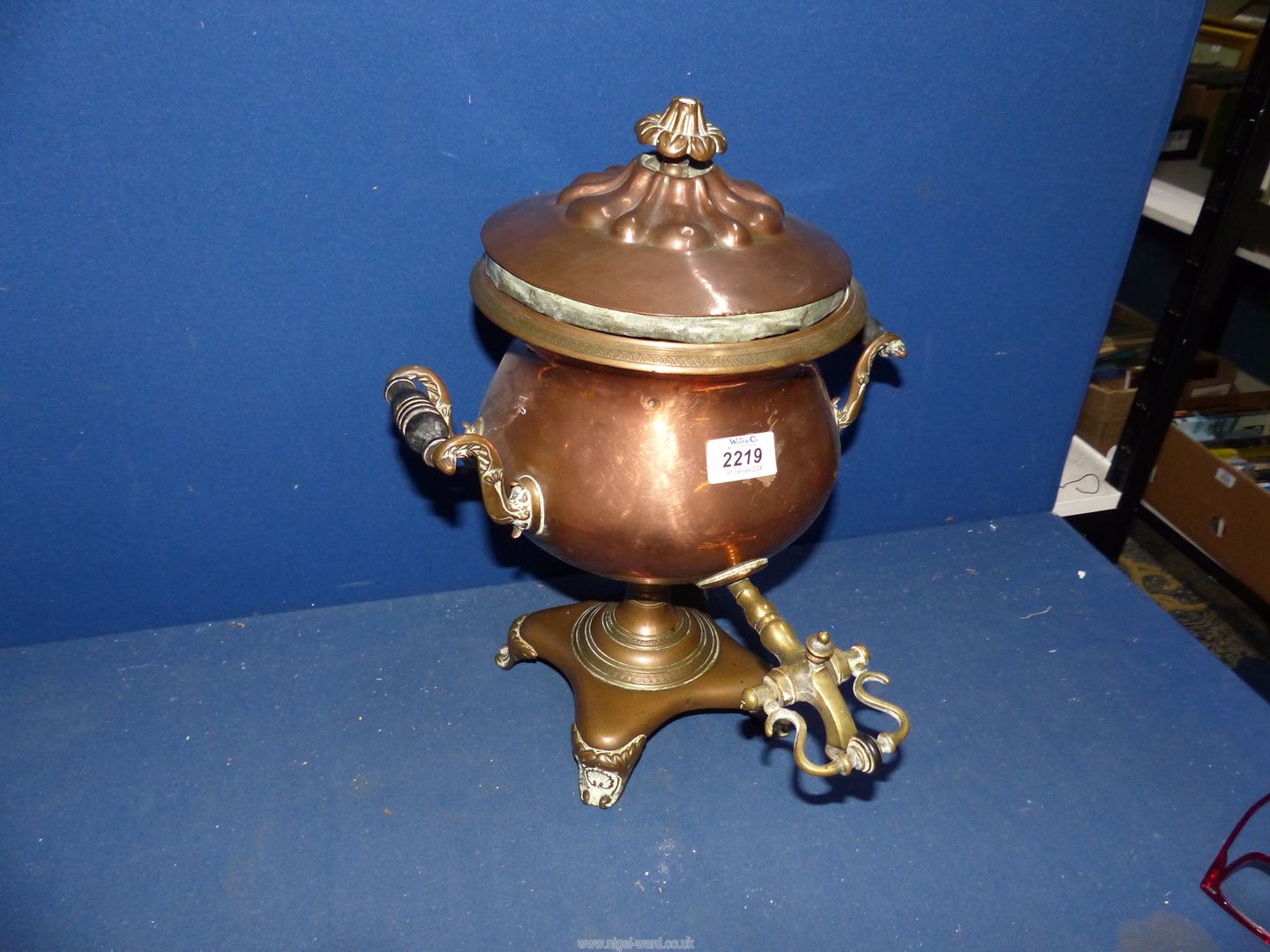 A copper Samovar with brass tap and turned wood handles, 15'' tall.