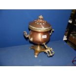 A copper Samovar with brass tap and turned wood handles, 15'' tall.