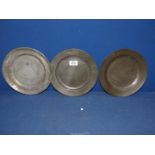 Three pewter plates, with marks to back.