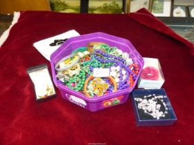 A quantity of costume jewellery including beads, bangles, brooches, necklaces, earrings, etc.