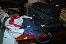 A quantity of laptop and other bags and seat belt harnesses for small dogs.