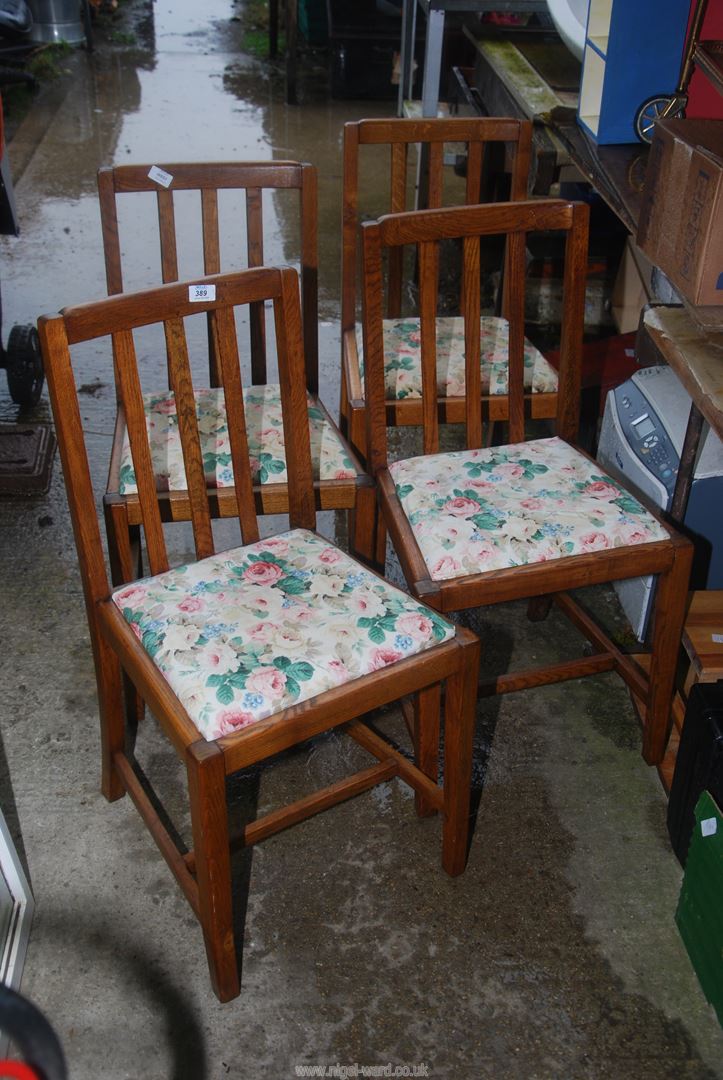 Four kitchen/dining chairs with upholstered seats.