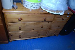 A pine sideboard with three long and three short drawers - 4' wide x 16½" depth x 29" high.