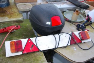 A Trailer Light Board and a Motorcycle Carrier Box (no key).