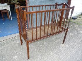 A fold-up vintage child's cot (no mattress).