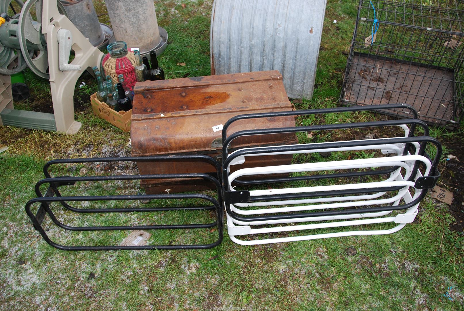 Wall mounted Racks and a Tin Trunk.