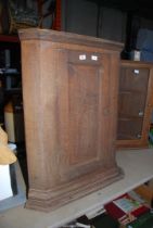 A wooden corner Cupboard with two shelves - 35" high x 27" wide.