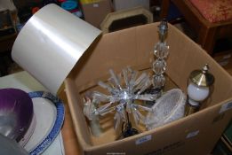 A box containing table lamps and shades.