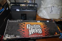 A 'Saisho' Television, Radio and Cassette player, plus 'Guitar Hero' for Playstation 2.