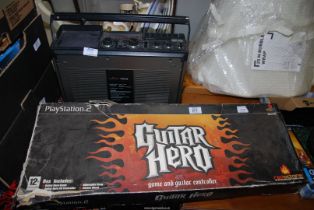 A 'Saisho' Television, Radio and Cassette player, plus 'Guitar Hero' for Playstation 2.