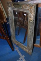 An ornate framed mirror - 28" x 43½".