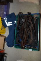 A selection of Horse tack including, Stirrups, reins, girths, etc.