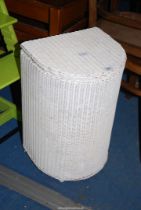 A Lloyd loom style linen bin.