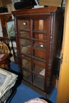 A glass fronted dark oak Bookcase- 34" x 13" x 62½" high.