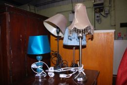 Four table lamps.